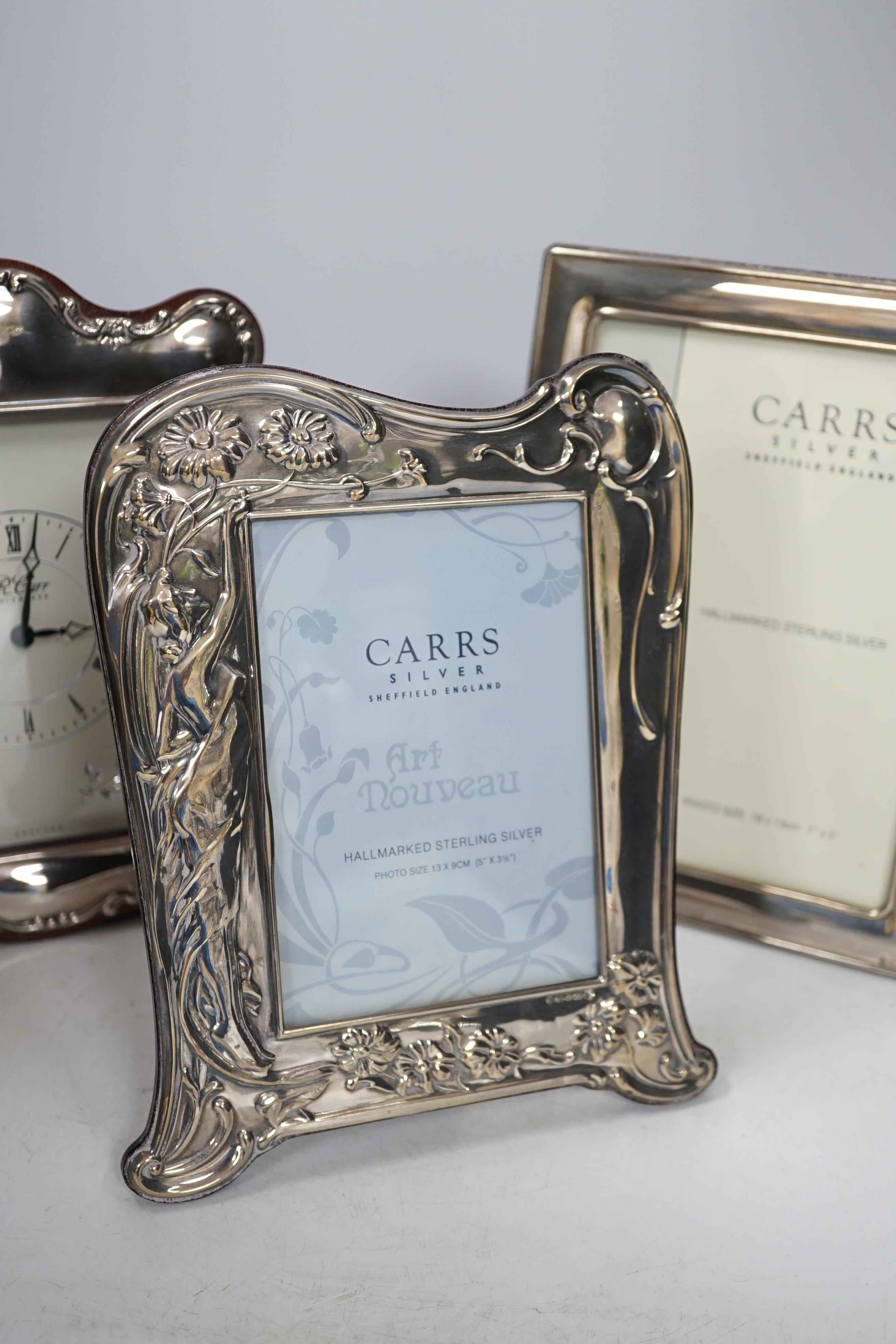 Two modern Carrs silver photograph frames, one of Art Nouveau design, 21cm, and a similar timepiece, 21cm